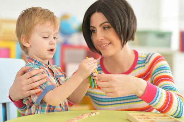 Young mother playing with son — Stock Photo, Image