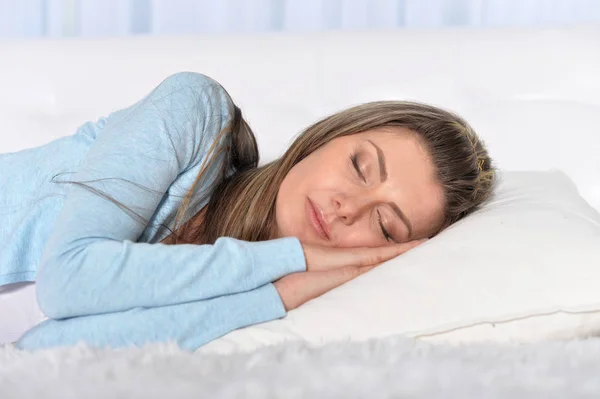 woman sleeping on pillow