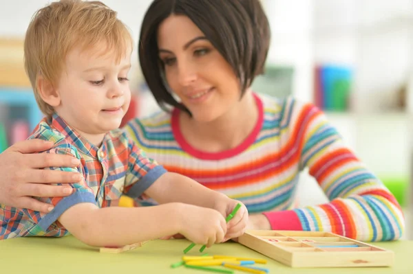 Young mother playing with son — Stock Photo, Image