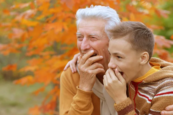 Grandfather and grandson hugging  in park — Stock Photo, Image