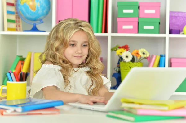 Cute little girl with laptop — Stock Photo, Image