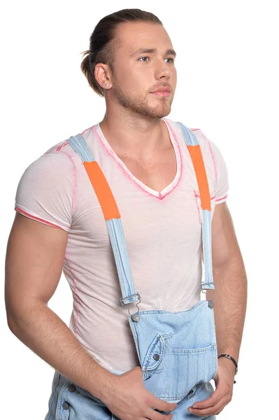 Handsome young man in jean overall — Stock Photo, Image