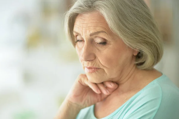 Beautiful sad elderly woman close-up — Stock Photo, Image