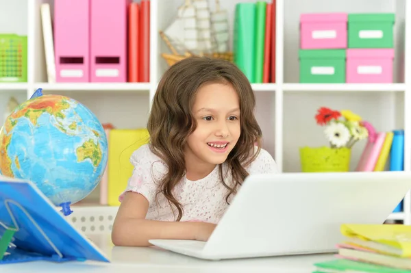 Adorable little girl with laptop — Stock Photo, Image