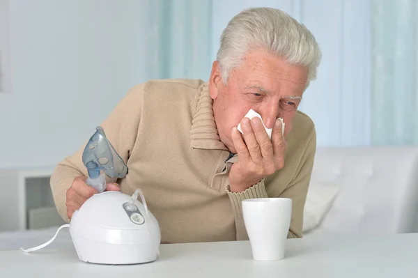 Elder man making inhalation — Stock Photo, Image