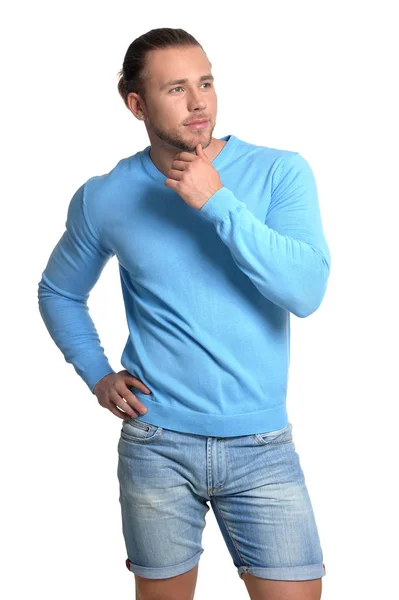 Schöner junger Mann im blauen Pullover — Stockfoto