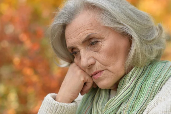 Sad senior woman Stock Photo