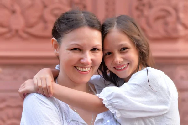 Mother hugging little daughter — Stock Photo, Image