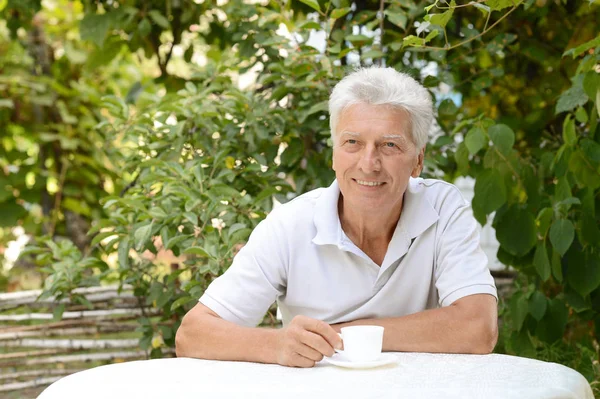 Mature man with cup — Stock Photo, Image