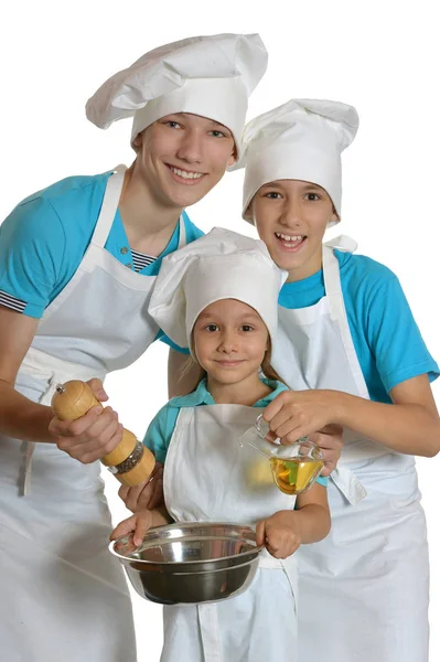 Two boys and girl in white aprons — Stock Photo, Image