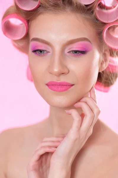 Beautiful  woman with hair curlers — Stock Photo, Image