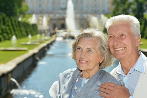 Senior couple hugging outdoors — Stock Photo, Image
