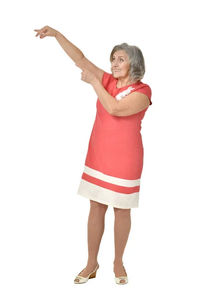 Mujer mayor en vestido señalando — Foto de Stock