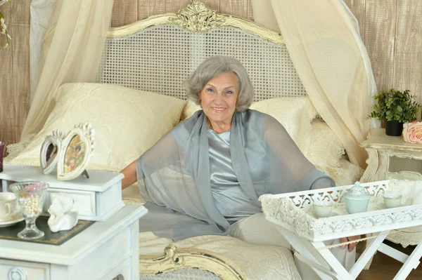 Senior woman having breakfast — Stock Photo, Image