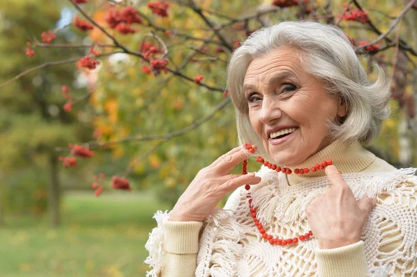 Woman  with lace from berries posing — Stock Photo, Image