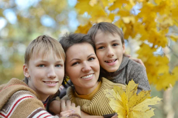 Happy family in autumn forest — Stock Photo, Image