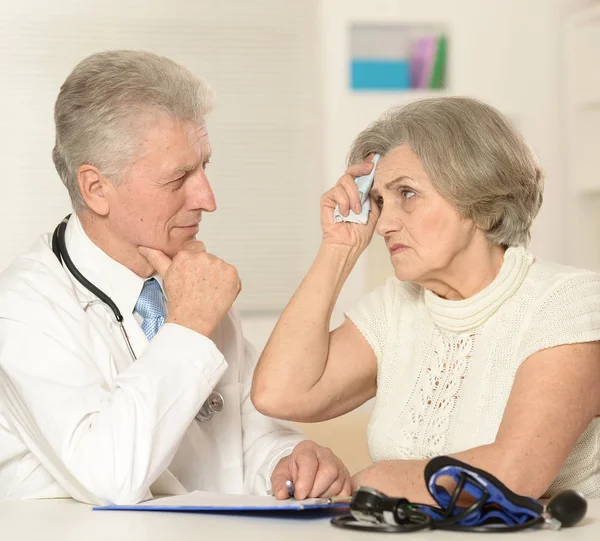 Senior doctor with elderly patient Stock Image