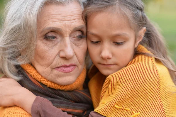 Sad grandmother with granddaughter — Stock Photo, Image