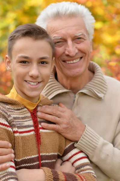 Grandfather and grandson hugging  in park — Stock Photo, Image