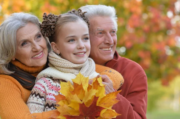 Grandparents and granddaughter in park — Stock Photo, Image