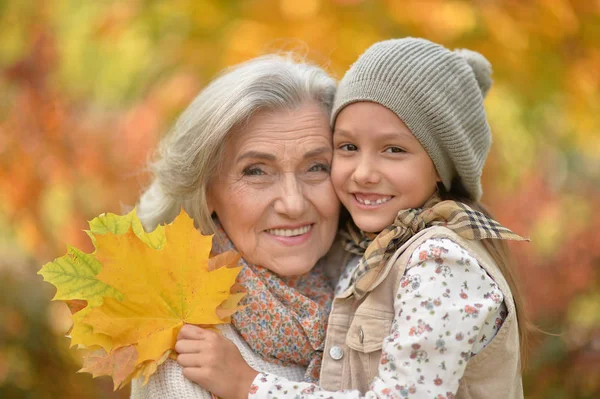 Smiling grandmother and granddaughter — Stock Photo, Image