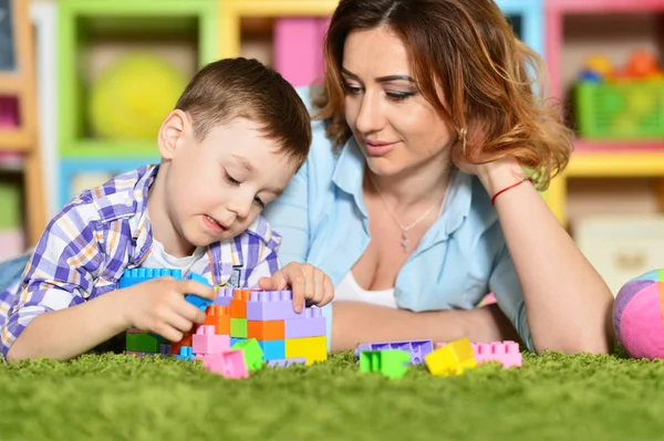 Young mother playing with son — Stock Photo, Image