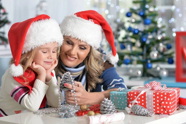 Woman and child girl celebrating Christmas — Stock Photo, Image