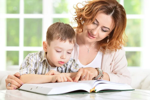 Mother and son doing homework — Stock Photo, Image