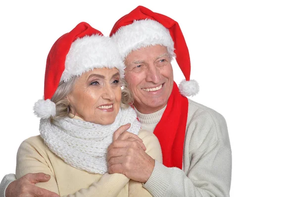 Seniorpaar mit Weihnachtsmann-Hüten — Stockfoto