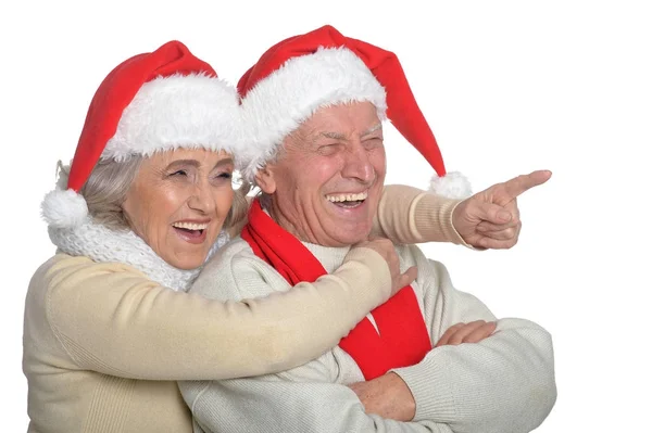 Seniorpaar mit Weihnachtsmann-Hüten — Stockfoto