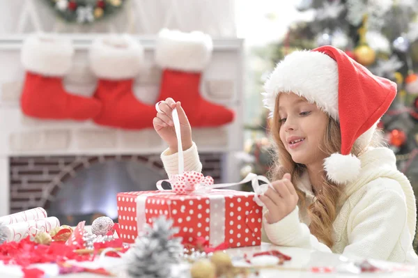 Little girl with het present — Stock Photo, Image