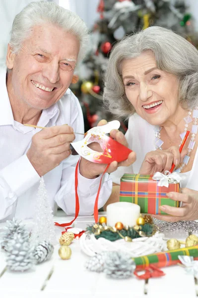 Senior couple preparing for Christmas — Stock Photo, Image