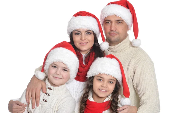 Rodina s dětmi v santa klobouky — Stock fotografie