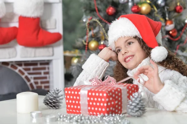 Little girl with Christmas present — Stock Photo, Image