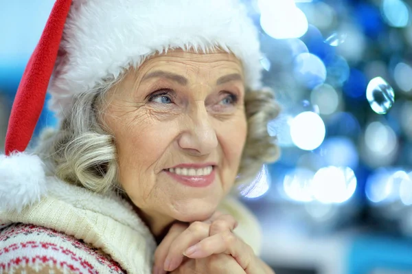 Senior woman in Santa hat — Stock Photo, Image