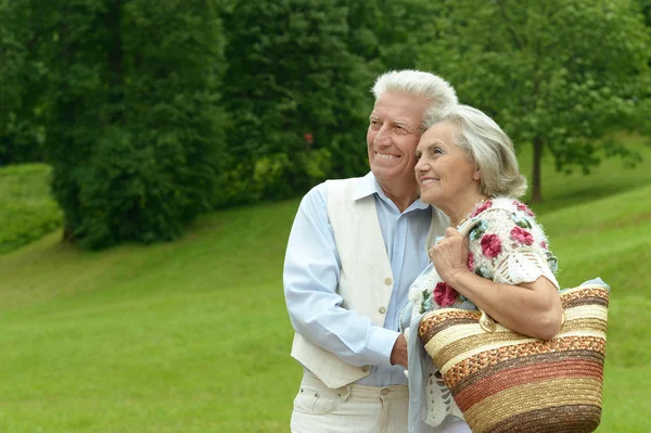 Mature couple in spring park — Stock Photo, Image