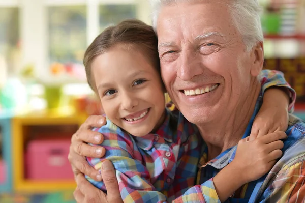 Grandfather and granddaughter having fun — Stock Photo, Image