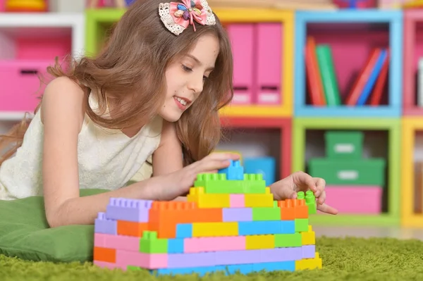 Curly Little Girl Playing Colorful Plastic Blocks — Stock Photo, Image