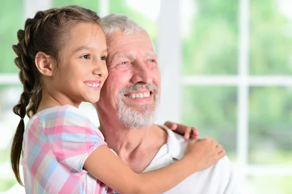Grandfather Her Granddaughter Hugging Home — Stock Photo, Image