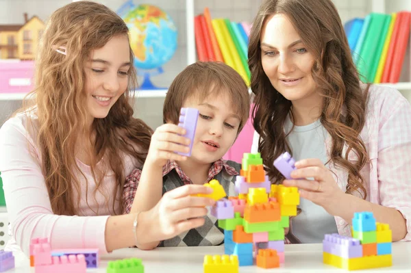 Family playing lego game — Stock Photo, Image