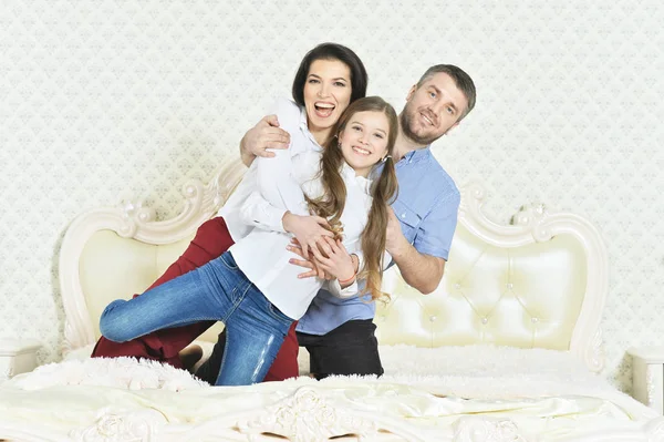 Little girl hugging parents — Stock Photo, Image