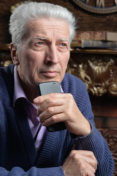 Portrait Thoughtful Senior Man Smartphone Home — Stock Photo, Image