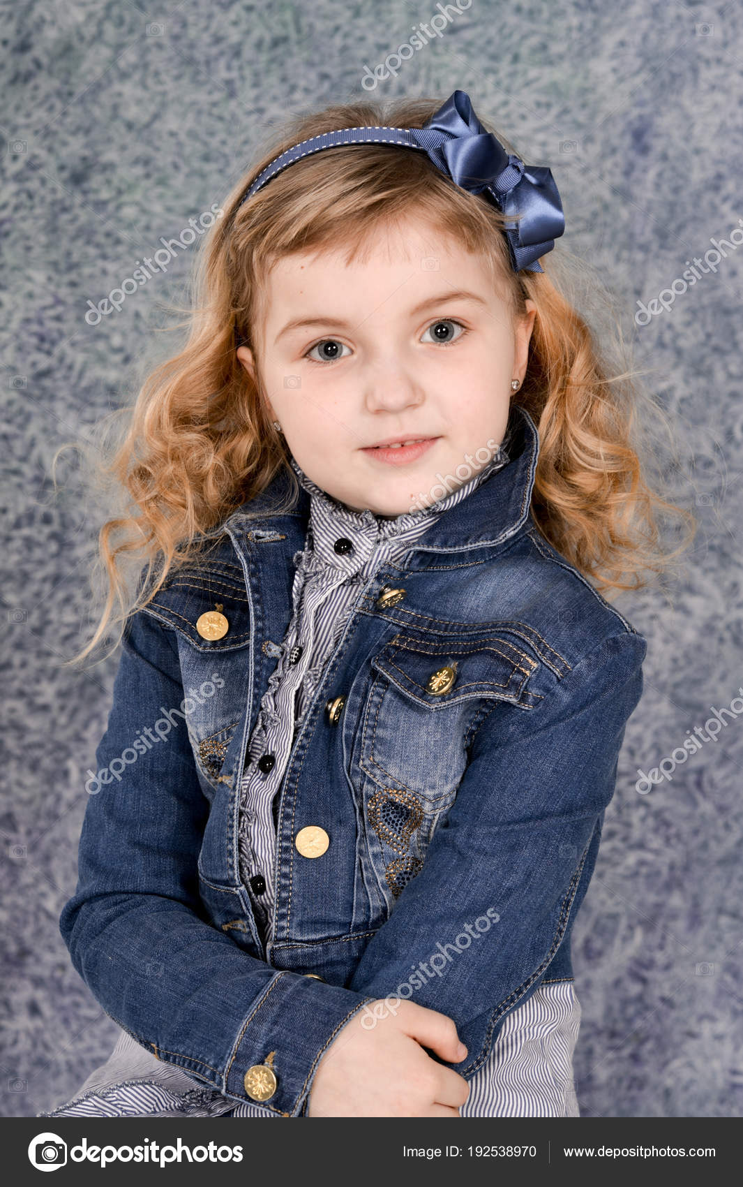 Cute Little Girl Jeans Jacket Posing Studio Stock Photo by ©aletia