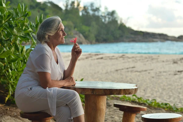 Old woman beach Stock Photos, Royalty Free Old woman beach Images