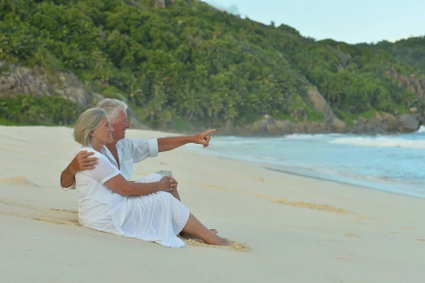 Happy Elderly Couple Tropical Beach Man Pointing Finger — Stock Photo, Image
