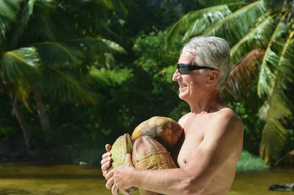 Senior man at tropical resort — Stock Photo, Image