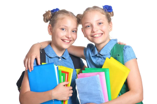 Schattig Schoolmeisjes Met Rugzakken Boeken Poseren Geïsoleerd Witte Achtergrond — Stockfoto