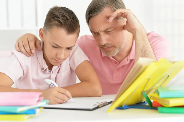 Father Son Lying Floor Doing Homework Together — Stock Photo, Image