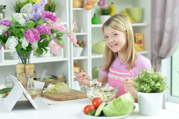 Cute Little Girl Preparing Fresh Salad Kitchen Table Tablet Home — Stock Photo, Image