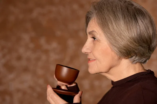 Beautiful Smiling Senior Woman Drinking Tea — Stock Photo, Image